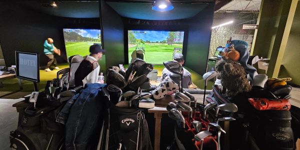 Guests playing TrackMan indoor golf